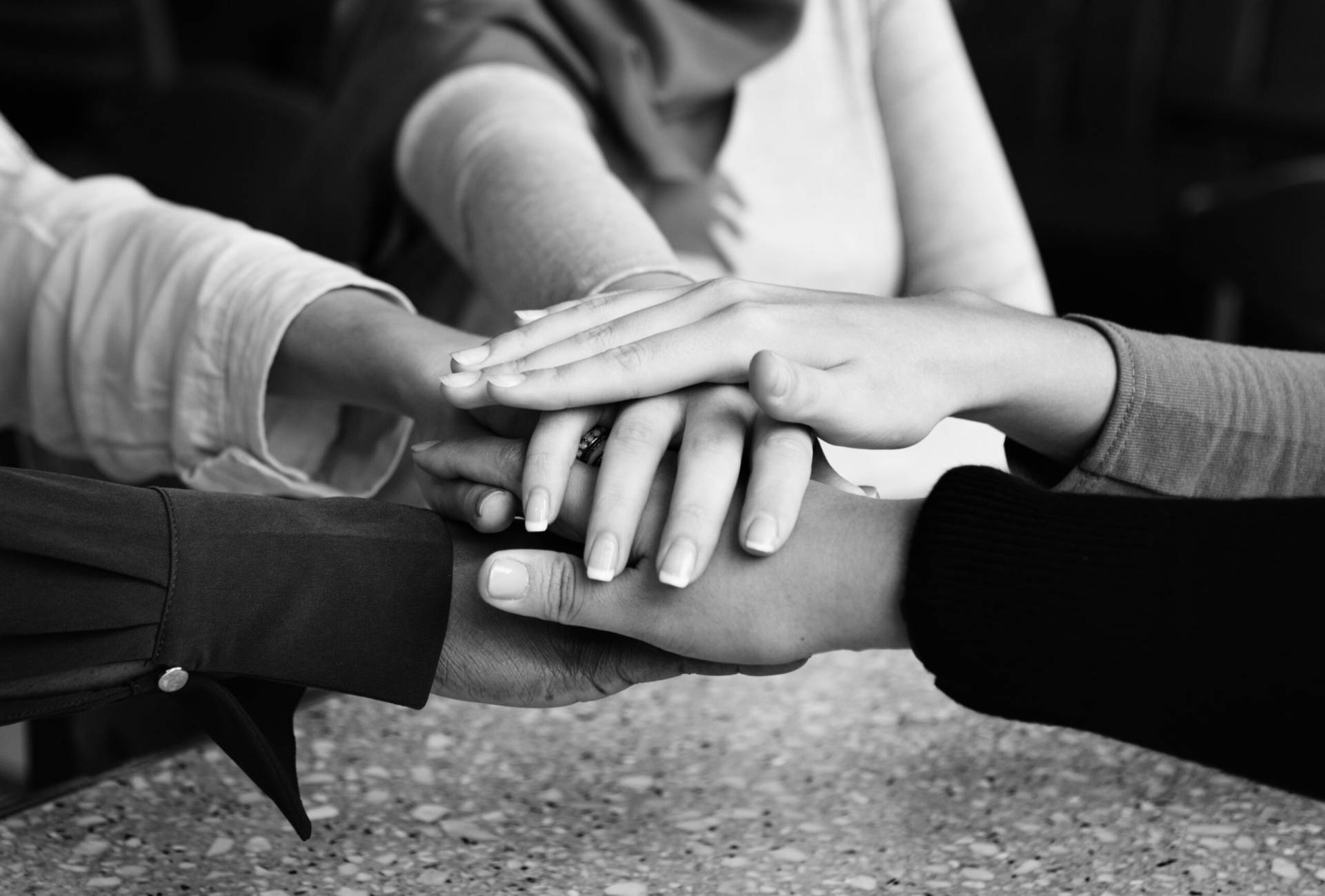 islamic friends hands stack teamwork 1 scaled